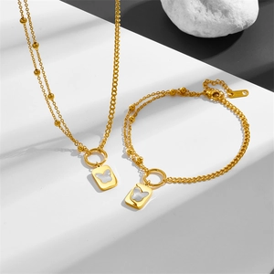 Golden double layer butterfly pendant necklace and bracelet set with white shell inlay