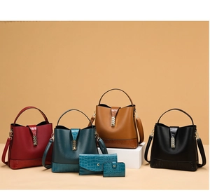 Detail view of multi-color tote bags with crocodile pattern texture and gold hardware