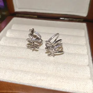 Elegant silver butterfly cuff earrings with zircon stones in a premium jewelry gift box