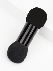 Detail of dual-ended makeup brush showing fine fiber bristles and high-density sponge tip