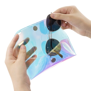Holographic PVC eyewear pouch showing an aviator sunglass being placed inside the case