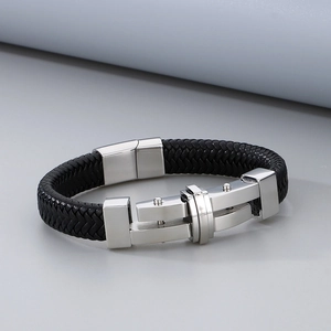 Close-up of black braided leather men's bracelet with a silver stainless steel clasp