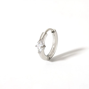 Detailed macro view of silver hoop earring featuring a marquise-cut sparkling zircon