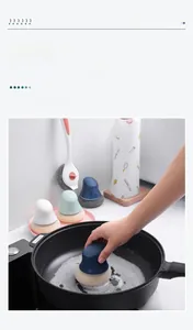 Detail of nylon kitchen scrubbing ball with colorful handle for non-scratch pan cleaning