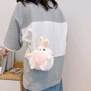 Cute white and pink plush rabbit crossbody bag with gold chain strap shown on model
