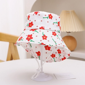 Detailed shot of kids' floral sun hat with adjustable chin strap and red flower print