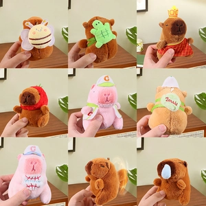 Plush Capybara keychains in various costumes like bee, turtle, and strawberry styles