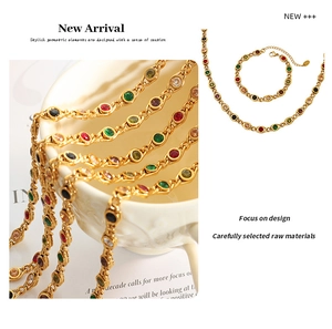 Macro detail of gold-plated necklace set with colorful zircons in fish-eye design