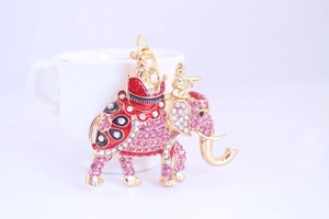 Close-up of pink rhinestone elephant keychain pendant with gold alloy lobster clasp detail