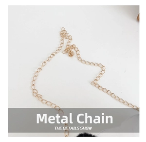 Close-up of the elegant golden metal chain strap accessory for plush cartoon bags