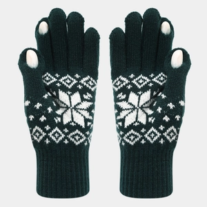 Detail of dark green knit gloves with white snowflake patterns and touchscreen fingertips