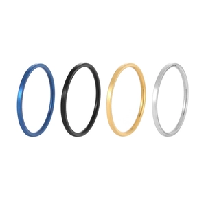 Set of four minimalist stainless steel round rings in blue, black, gold and silver finishes