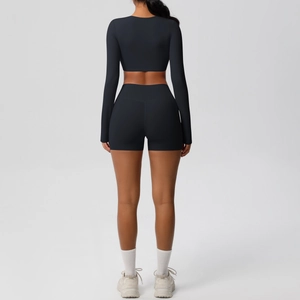 Detail of black seamless yoga set showing double-sided brushed fabric and crop top design