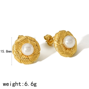 Golden titanium steel pearl earrings featuring rope textured round studs and white pearls