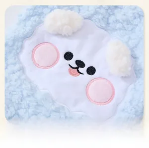 Detailed close-up of a cute embroidered puppy patch on soft blue fleece pet clothing