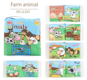 Detail of soft farm animal cloth book for babies with squeaker and hanging ring loop