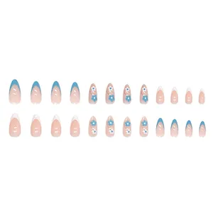Blue and white almond press-on nails set with floral designs and French tips