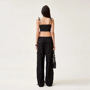 Streetwear set featuring black cropped tank top and multi-pocket cargo pants from back view