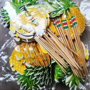 Detail of disposable bamboo fruit picks featuring 3D decorative pineapple designs