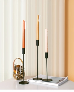 Three-piece set of black Nordic metal candle holders with slim stems and round bases