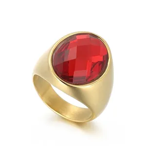 Retro titanium steel gold plated ring with a large oval red faceted glass gemstone