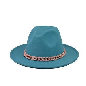 Detail of teal wool fedora hat featuring a chunky decorative pink plastic chain accessory