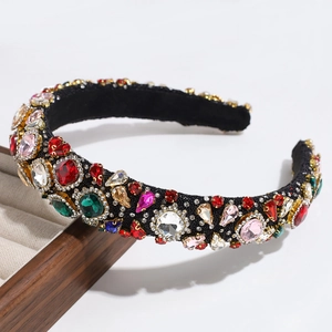 Detailed close-up of luxury black headband with colorful rhinestones and sparkling gems