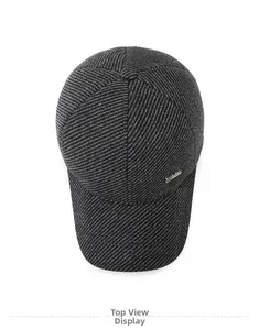 Top down view of deep grey wool baseball cap with diagonal texture and side metal logo