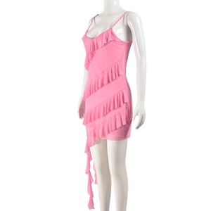 Detail of pink tiered ruffle dress with delicate spaghetti straps on a white mannequin
