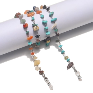 Handmade eyeglass chain with colorful natural stones and silver metal links on display