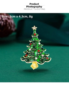 Close-up of green enamel Christmas tree brooch with rhinestones, 3cm x 4.3cm size detail
