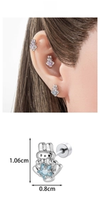 Macro detail of cartoon bunny ear stud with blue star zircon and screw back clasp