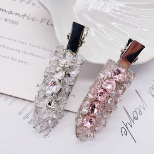 Elegant crystal and pearl hair clips set in pink and white with a silver alloy base