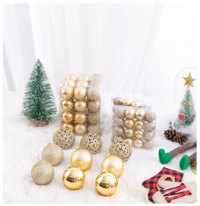 Detailed view of assorted gold Christmas ornaments with glitter and hollow designs