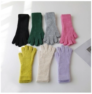 Selection of warm knitted rabbit fur gloves in various soft pastel colors for women