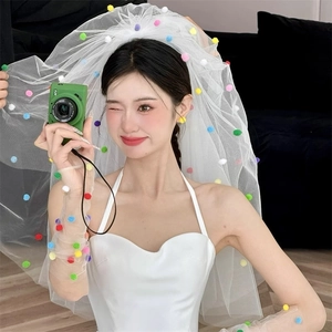 White wedding veil and mesh gloves set decorated with colorful pom-poms for party decor