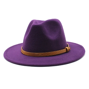 Detail of dark purple wool fedora with brown snake pattern leather band and metal buckle
