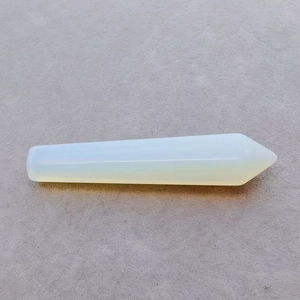 Macro detail of a hexagonal milky opal crystal column showing smooth polished surface