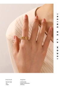 Close-up of 18K gold plated woven mesh ring showing intricate braided metal craftsmanship