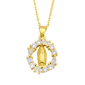 Golden Virgin Mary heart pendant necklace with cubic zirconia stones on white background