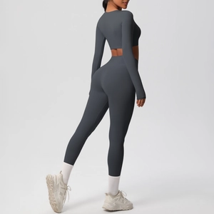 Detailed view of dark grey long-sleeve crop top and high-waist fitness leggings set