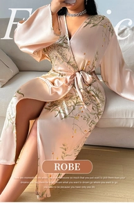 Detail view of the floral satin robe fabric featuring elegant leaf and berry print