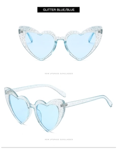 Detail of glitter blue heart-shaped sunglasses with sparkling blue frames and lenses