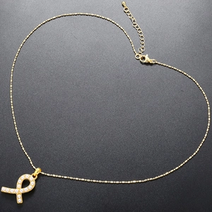 French vintage 18K gold plated ribbon necklace with white pearls on a bead chain