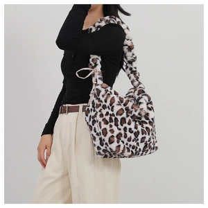 Close-up of leopard print faux fur hobo bag with soft texture and wide shoulder strap