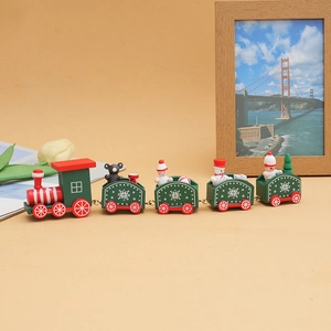 Detailed view of a Christmas wooden train with snowmen and trees on a yellow background