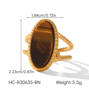 Detail view of gold vintage tiger eye ring with precise height and width measurements