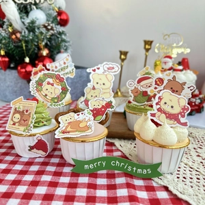 Christmas bear and Santa cake toppers set on festive red checkered tablecloth