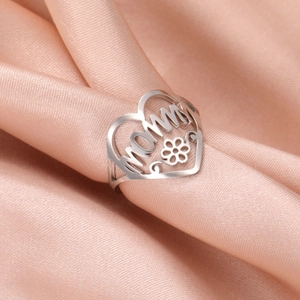 Hollow heart MOMMY open ring in silver stainless steel on champagne satin background