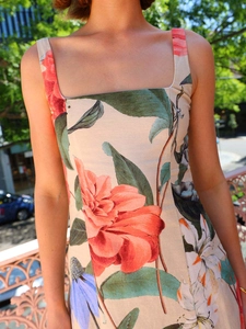 Detailed close-up of square neckline and floral print on a summer sundress